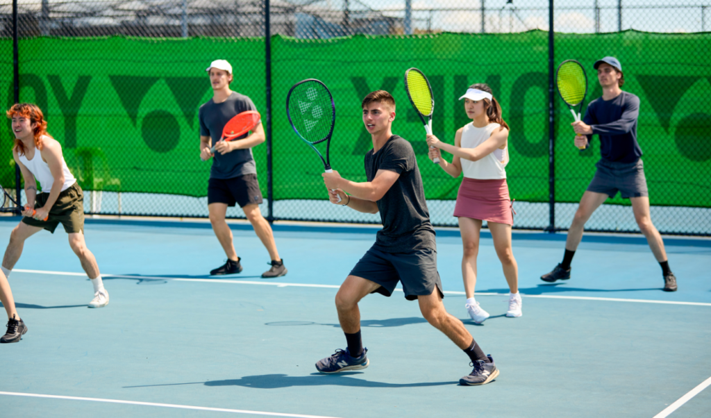 Players enjoying a casual hit on court at East Coburg Tennis Club